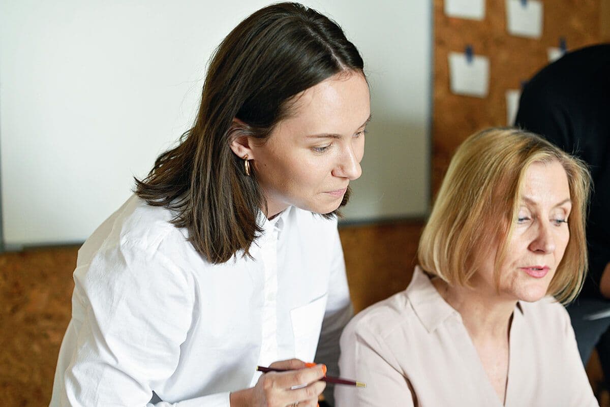 Employees discussing skills gap analysis at work