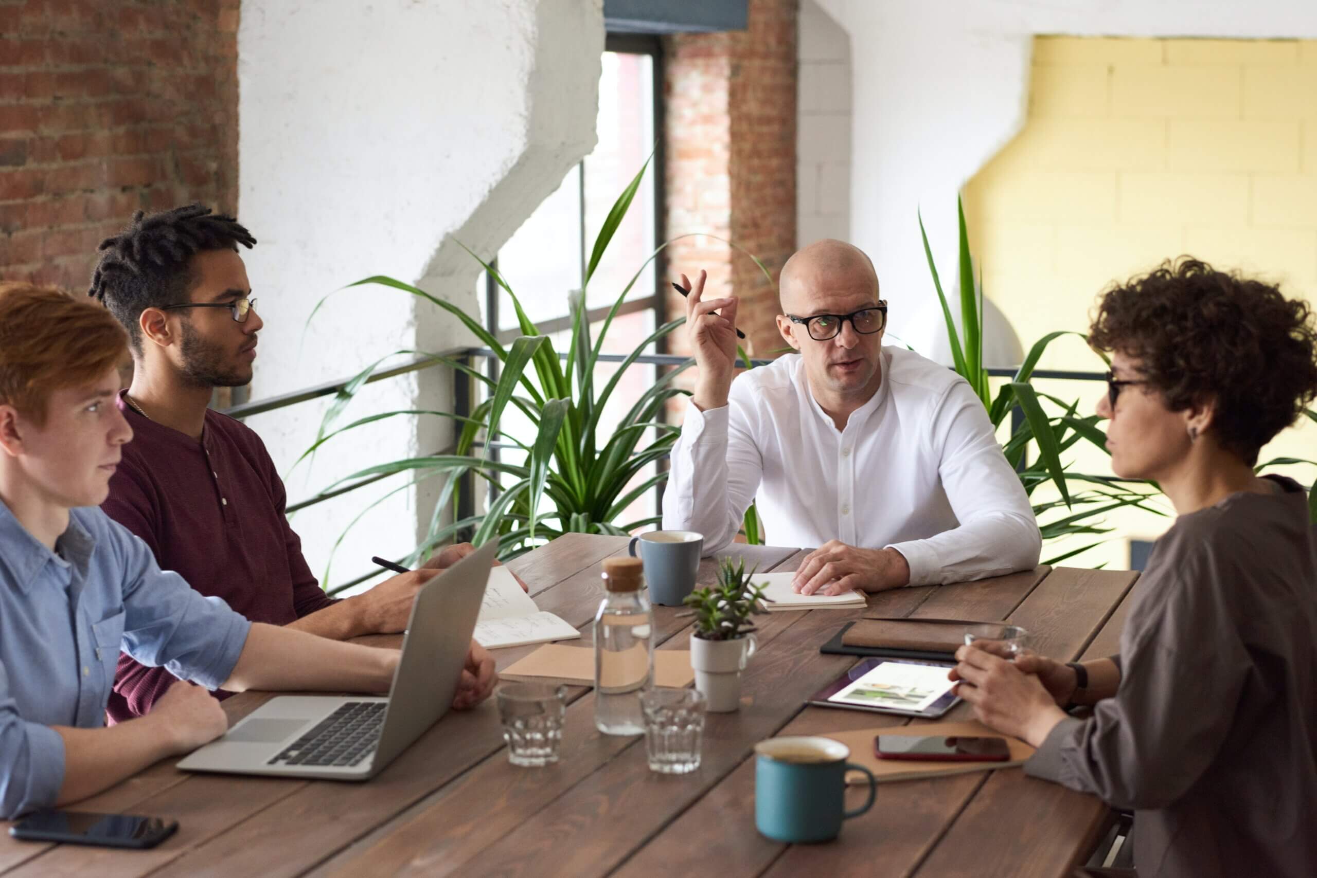 Employee resource group members meeting around a table