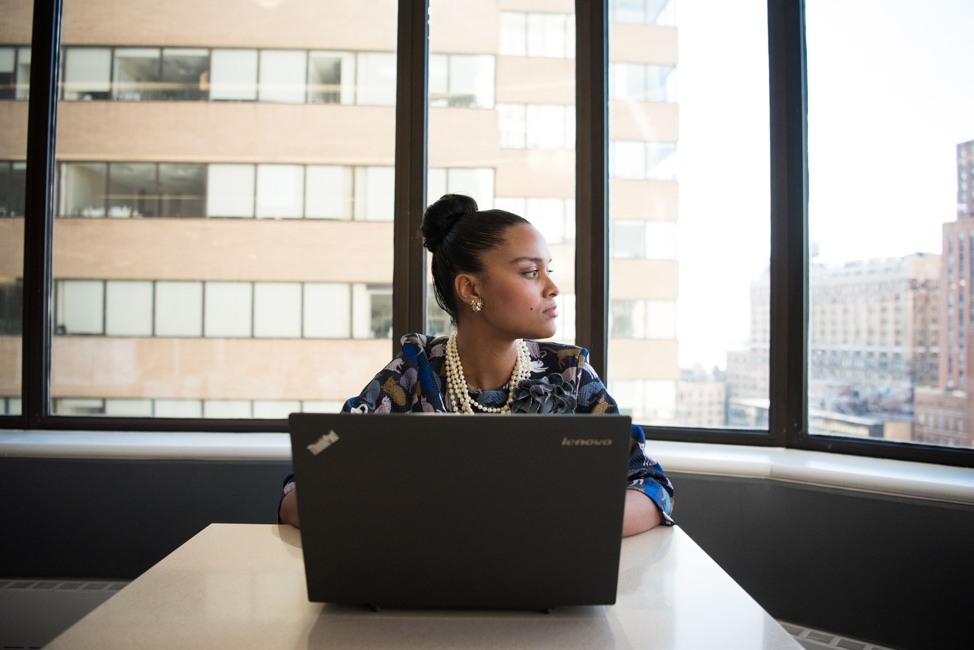 Black woman employee feeling excluded in the office
