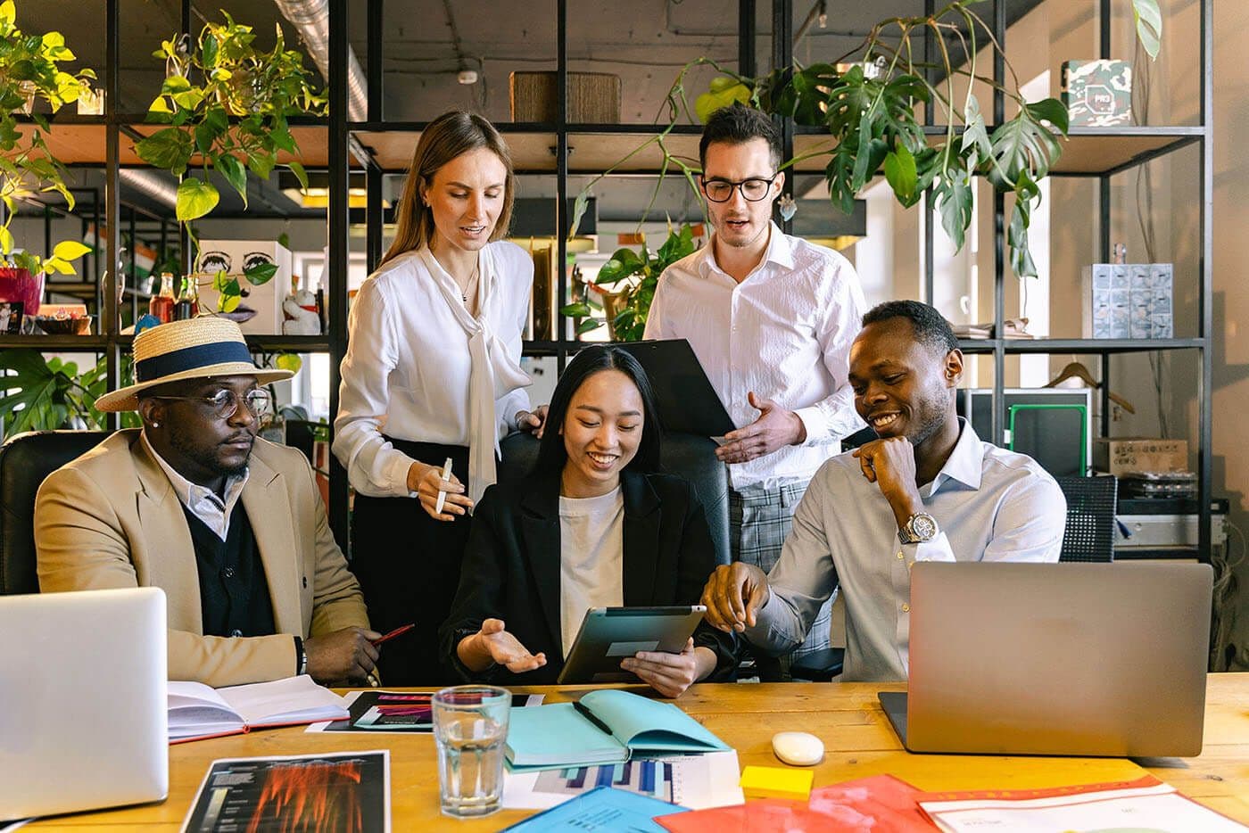 A workplace meeting including a gender-diverse team.
