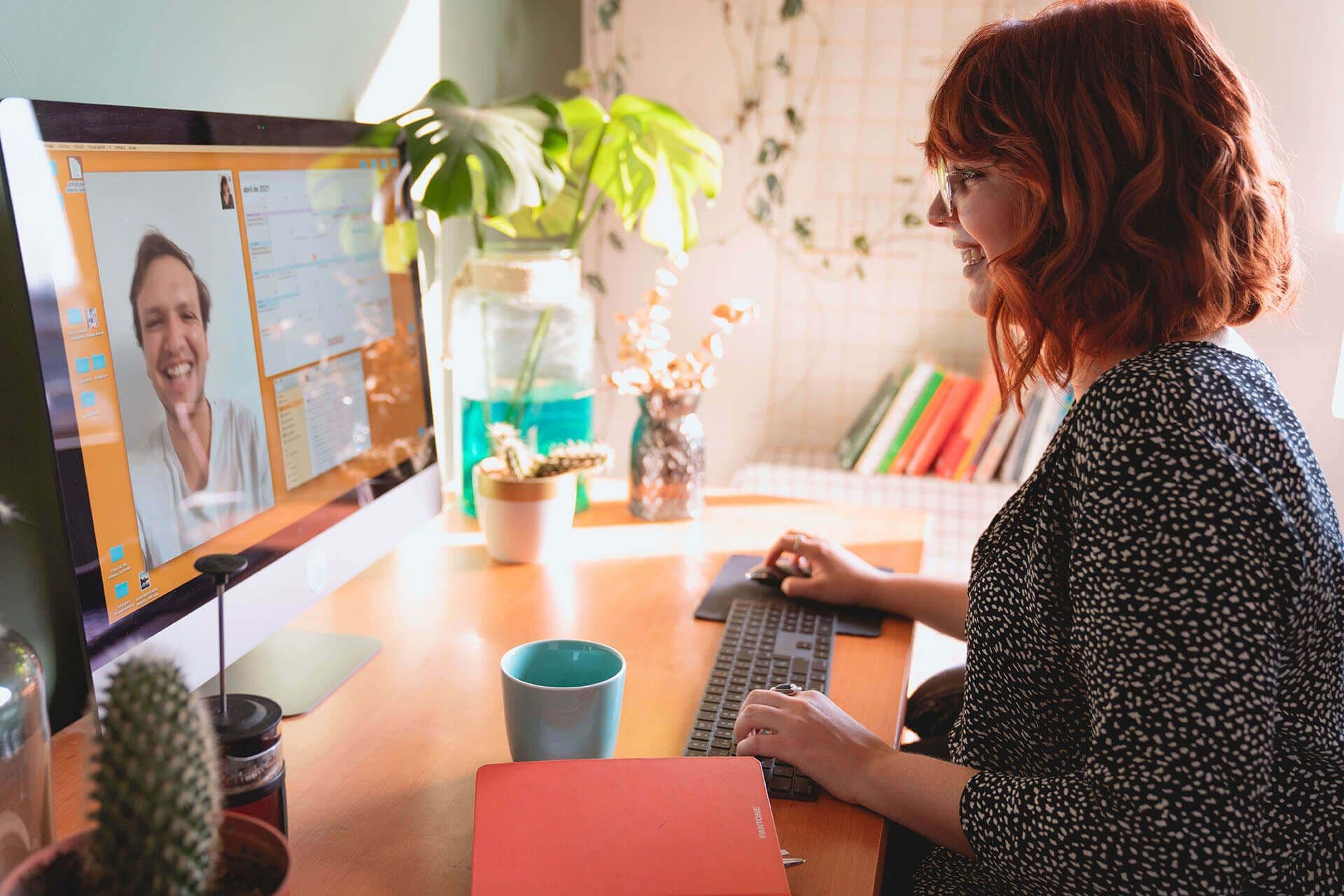 virtual mentoring meeting between male and female coworkers
