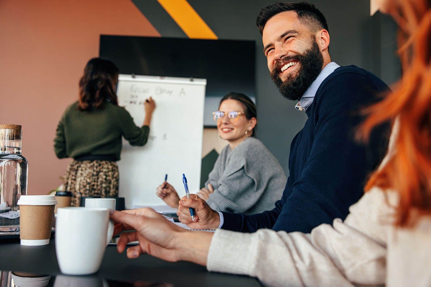 man and woman employee at an Employee resource group meeting in the office