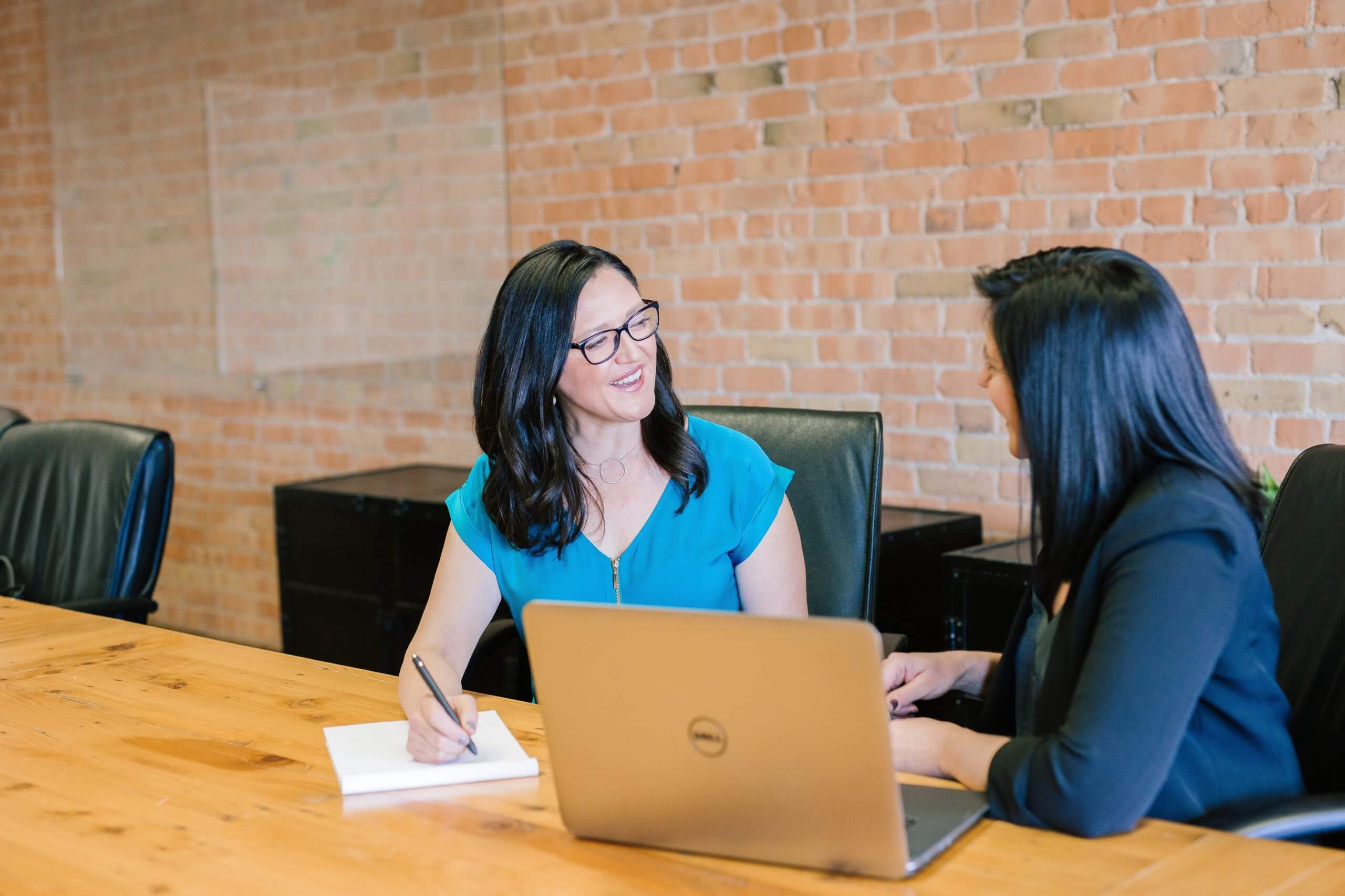 Employees discussing leadership coaching at work